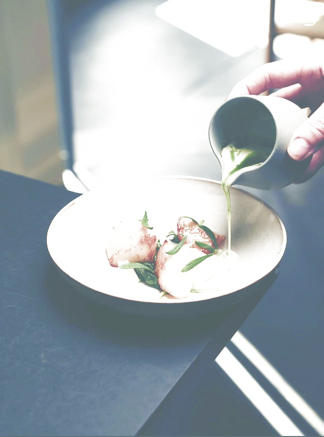 Finishing a dish at the pass